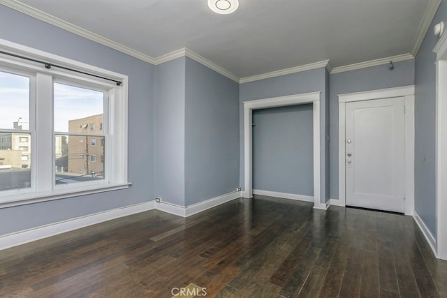 unfurnished bedroom with crown molding, dark hardwood / wood-style flooring, and a closet