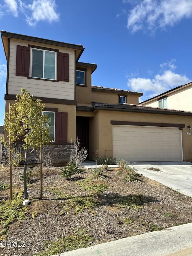 view of front of home with a garage