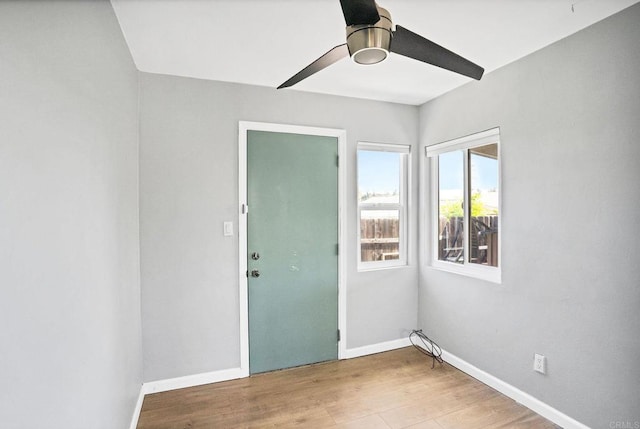 unfurnished room featuring ceiling fan and light hardwood / wood-style flooring