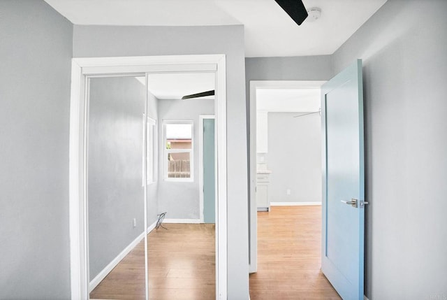 corridor with light wood-type flooring