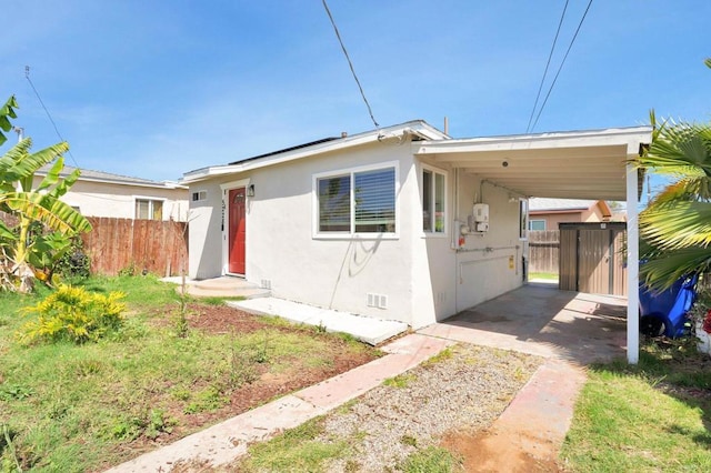 view of front of house with a carport