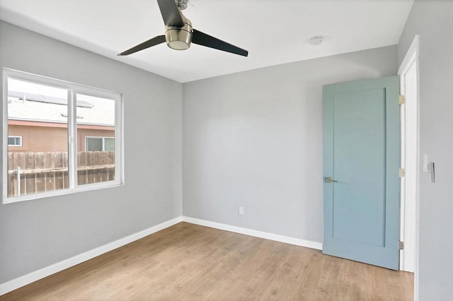 unfurnished room featuring ceiling fan and light hardwood / wood-style flooring