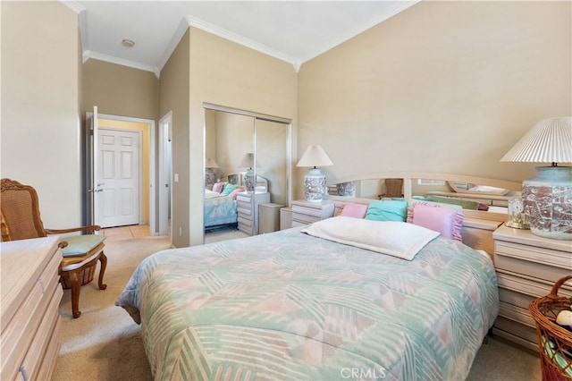 bedroom featuring crown molding, light colored carpet, and a closet