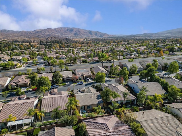 birds eye view of property with a mountain view