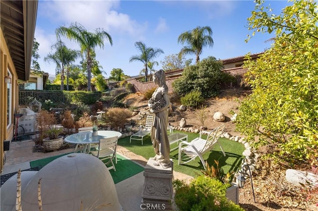 view of patio featuring a grill