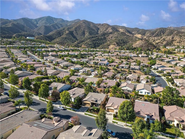 birds eye view of property featuring a mountain view