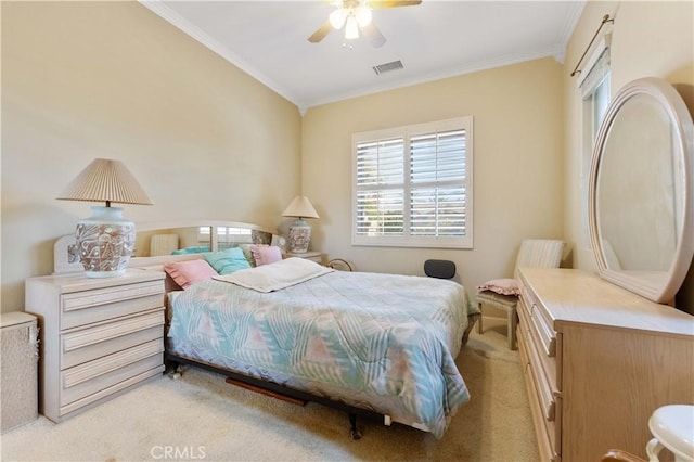 carpeted bedroom featuring crown molding and ceiling fan