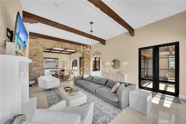 living room featuring light tile patterned floors, beam ceiling, and french doors