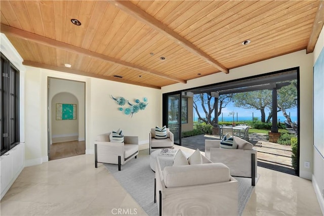 living room with beam ceiling and wood ceiling