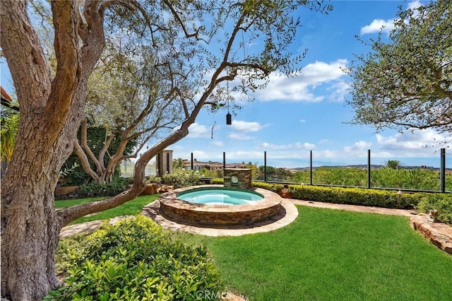 view of pool featuring a yard and an in ground hot tub