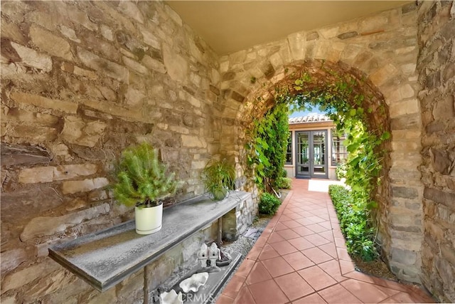 view of exterior entry featuring french doors