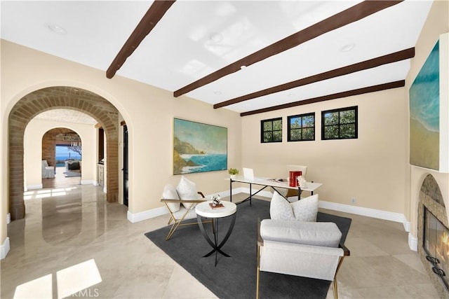 living area featuring beam ceiling