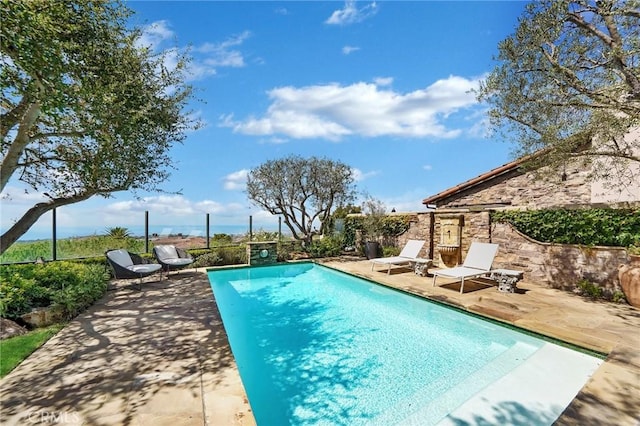 view of pool featuring a patio area