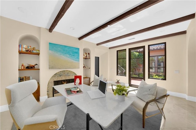 dining room with built in shelves and beam ceiling