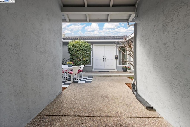 entrance to property with a patio