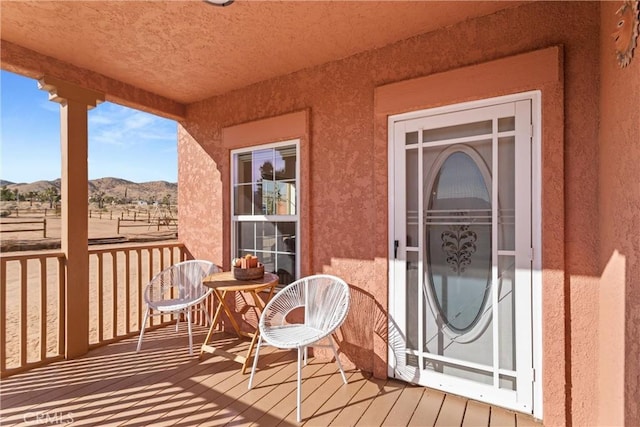 balcony featuring a mountain view