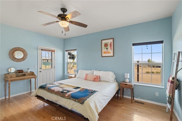 bedroom featuring wood-type flooring and ceiling fan