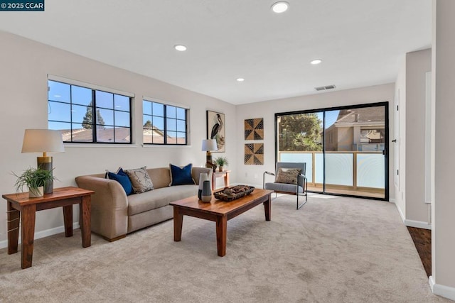 living room featuring light colored carpet