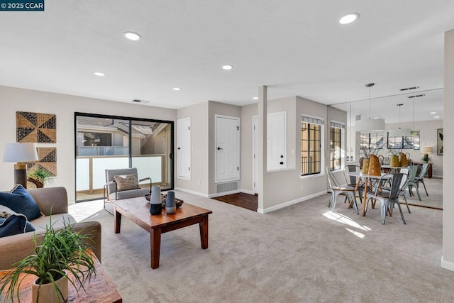 carpeted living room featuring a wealth of natural light