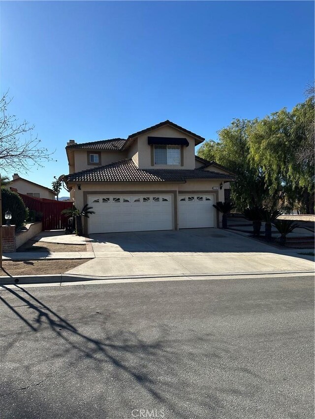 view of front of property with a garage