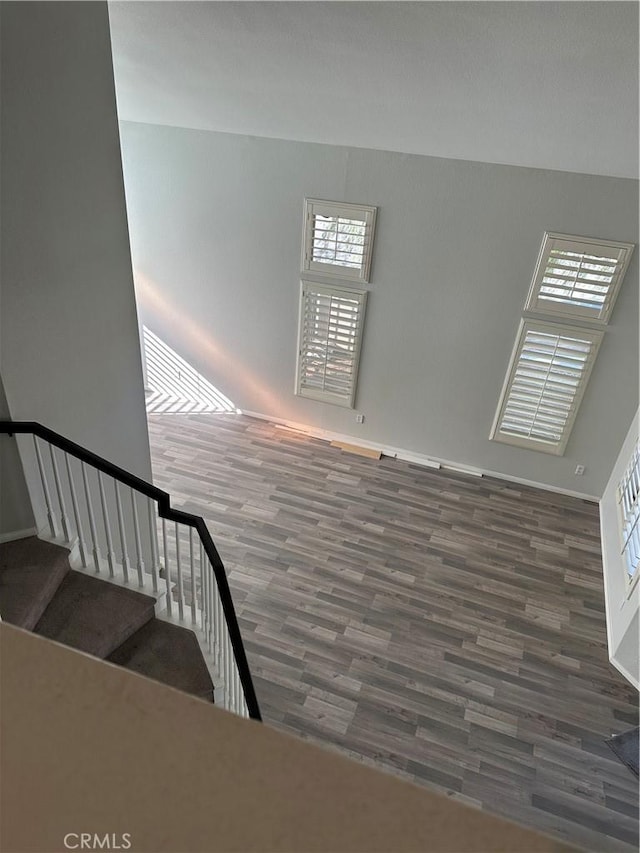 stairway with hardwood / wood-style floors