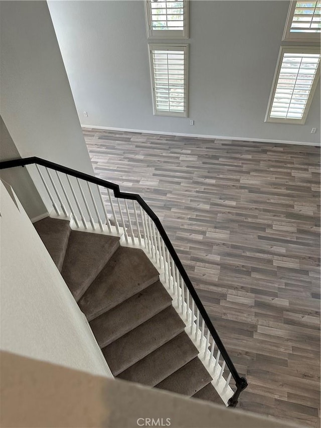 1310 Parsley Ln, Corona, CA 92879 - stairway featuring wood finished floors