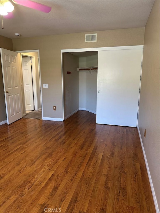 1310 Parsley Ln, Corona, CA 92879 - unfurnished bedroom featuring wood finished floors, a closet, and a ceiling fan