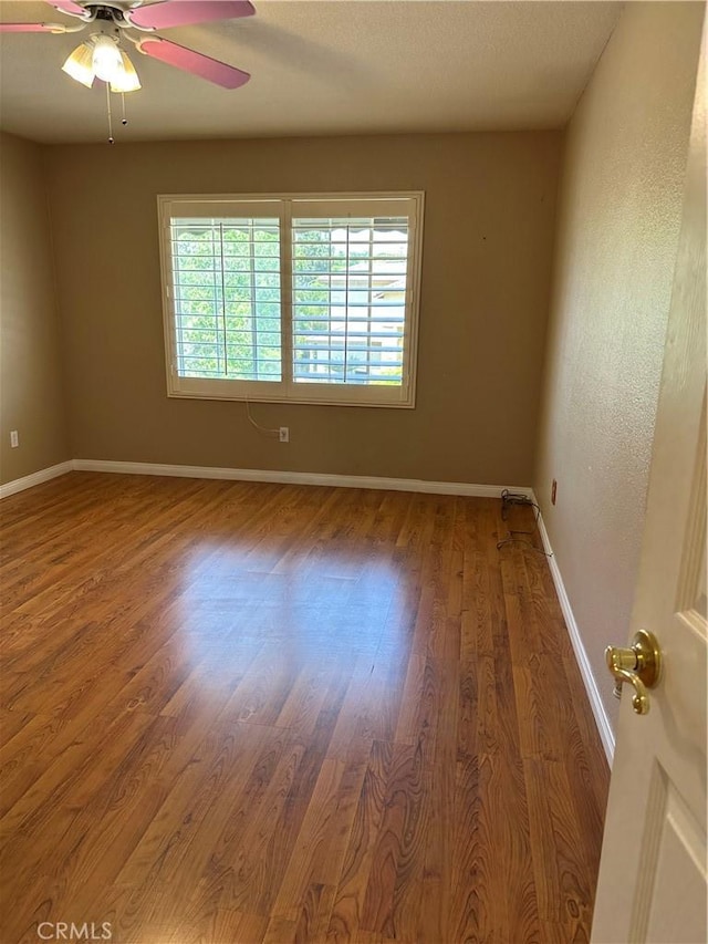 1310 Parsley Ln, Corona, CA 92879 - unfurnished room with a ceiling fan and wood finished floors