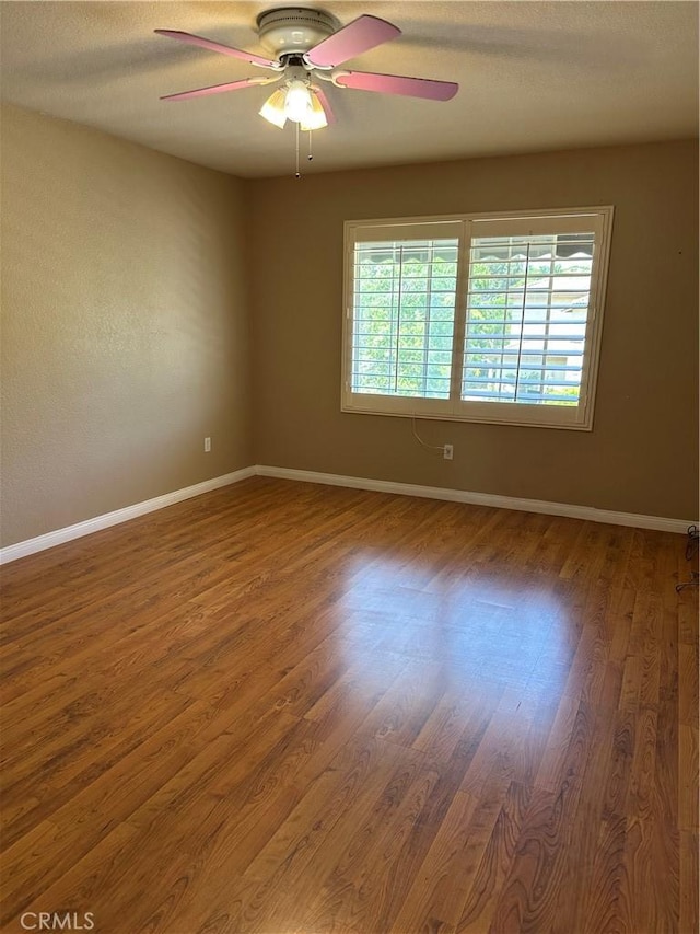 1310 Parsley Ln, Corona, CA 92879 - spare room with a ceiling fan and wood finished floors