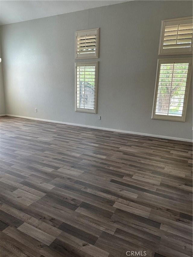 1310 Parsley Ln, Corona, CA 92879 - spare room featuring dark wood finished floors and baseboards