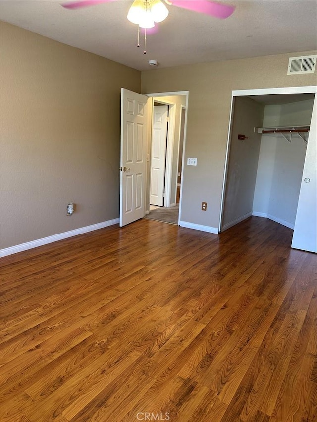 1310 Parsley Ln, Corona, CA 92879 - unfurnished bedroom with wood finished floors, a ceiling fan, and a closet
