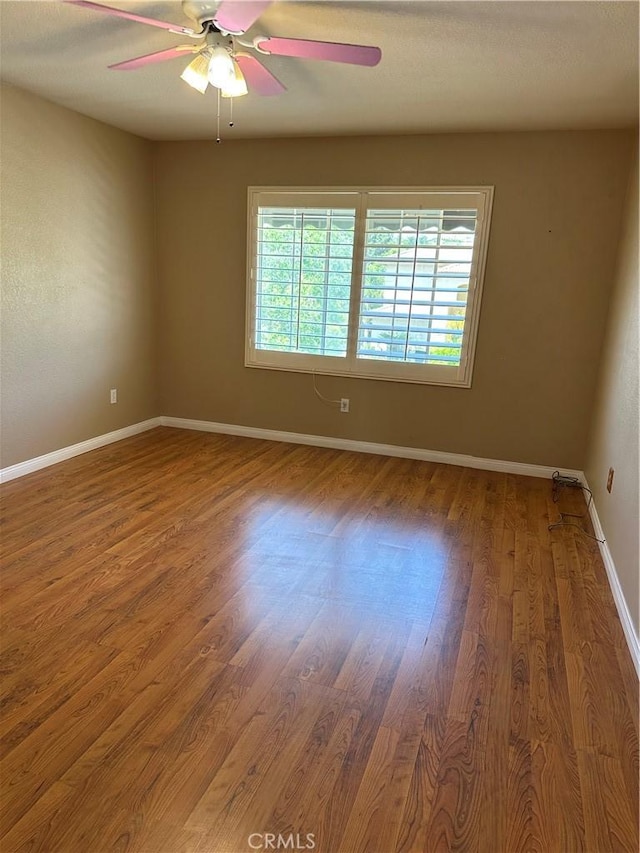 1310 Parsley Ln, Corona, CA 92879 - empty room featuring wood finished floors and ceiling fan