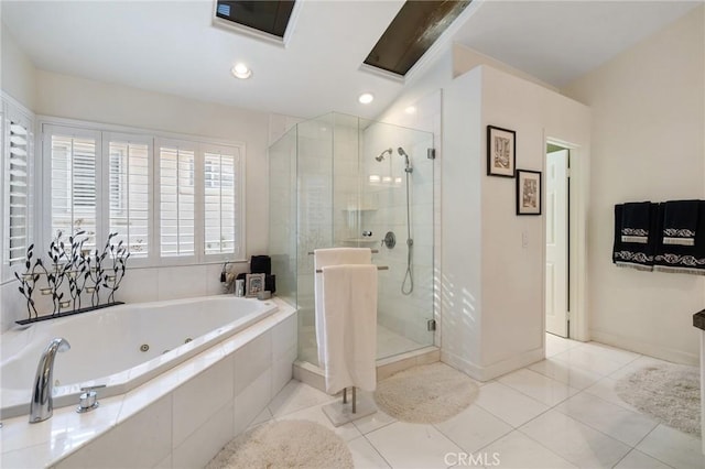 bathroom with tile patterned floors and independent shower and bath