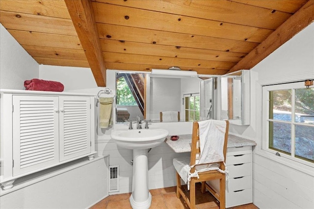 bathroom with wood ceiling and vaulted ceiling with beams