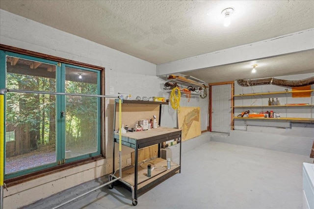 basement featuring a textured ceiling