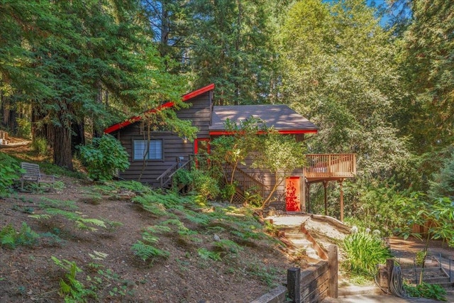 view of yard with a wooden deck