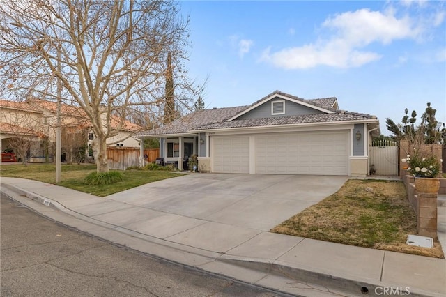 ranch-style home featuring a garage and a front lawn