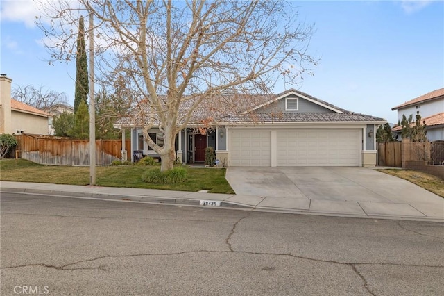 ranch-style house featuring a garage and a front yard