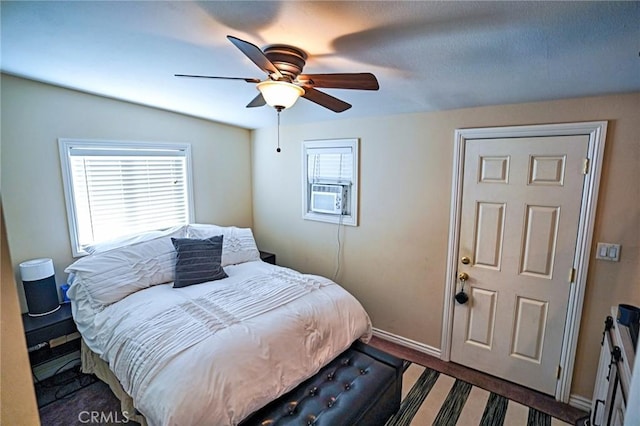 bedroom with lofted ceiling, cooling unit, and ceiling fan