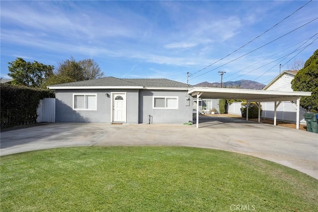 ranch-style home featuring a front yard