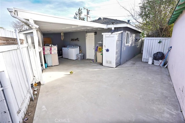 view of patio featuring washer and clothes dryer