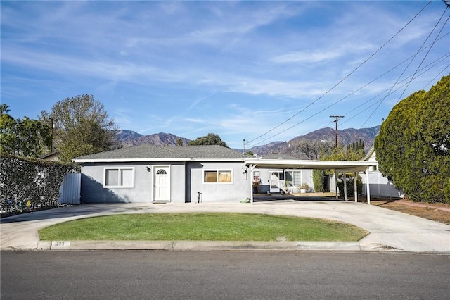 single story home featuring a carport and a mountain view