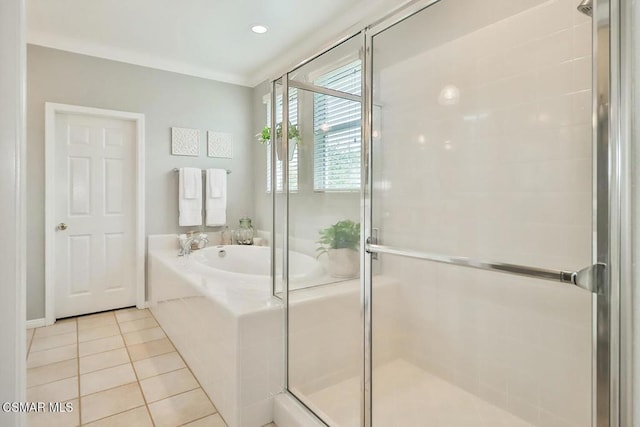 bathroom featuring tile patterned flooring, crown molding, and independent shower and bath