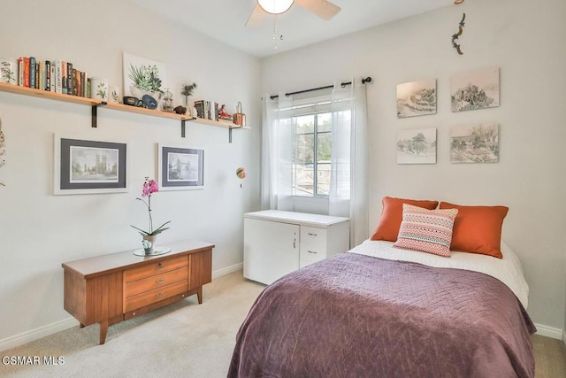 bedroom featuring light carpet