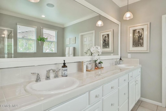 bathroom with vanity, crown molding, tile patterned floors, and walk in shower