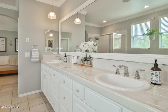 bathroom featuring crown molding, tile patterned floors, walk in shower, and vanity