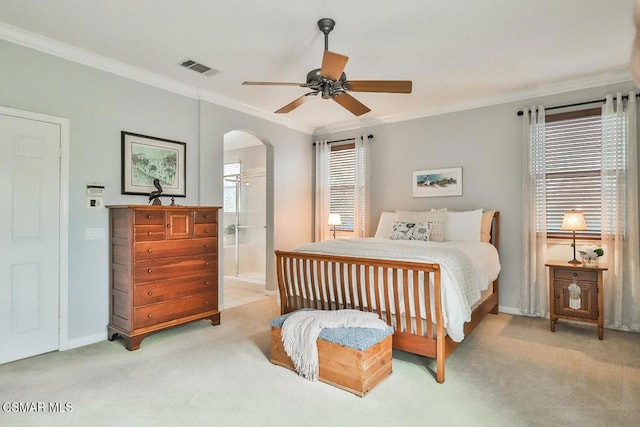 carpeted bedroom featuring multiple windows, connected bathroom, crown molding, and ceiling fan