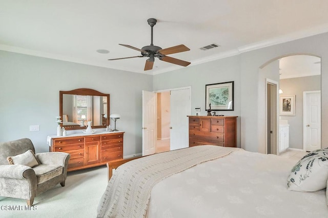 bedroom featuring crown molding, light colored carpet, and ceiling fan