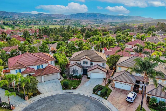 birds eye view of property with a mountain view