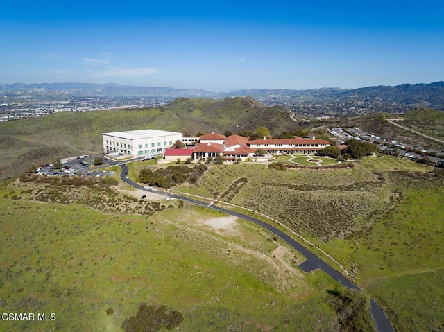 birds eye view of property with a mountain view